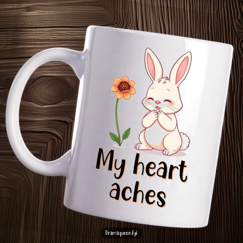 Funny bunny mug depicting a dramatic rabbit clutching its chest while gazing sadly at a wilting flower, expressing comical despair.