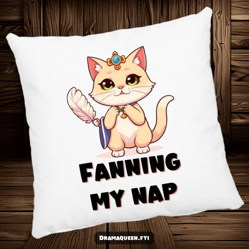 Funny regal cat dramatically fanning herself with a feather on a pillow, offering cozy drama and luxurious humor.
