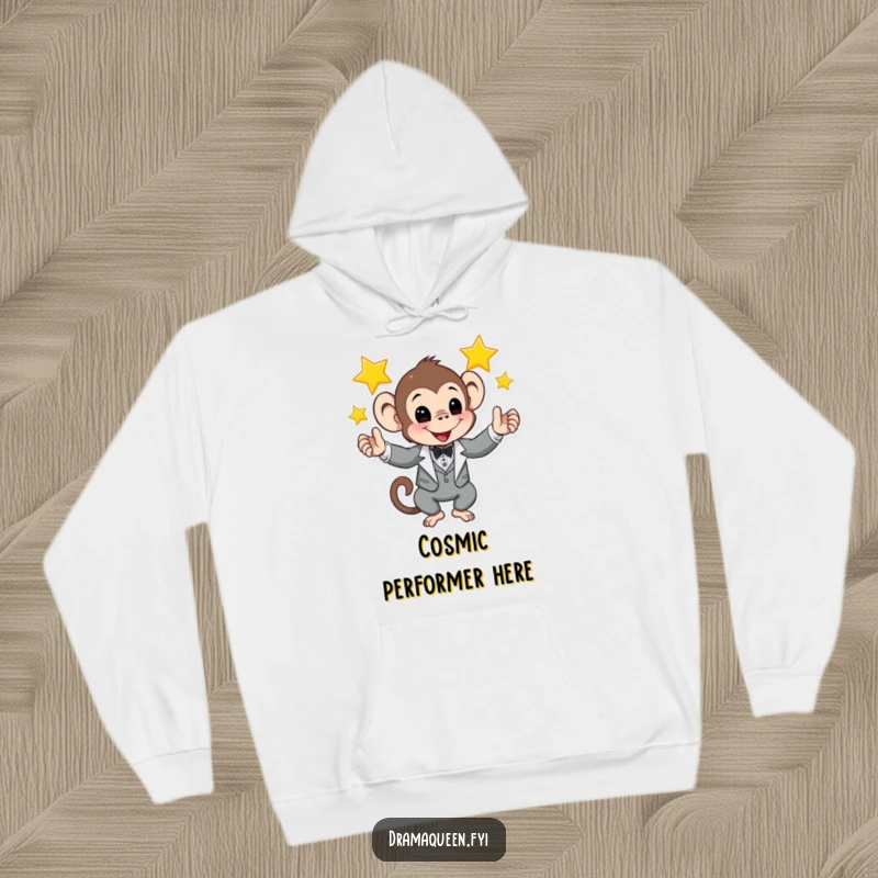 Funny hoodie showing a monkey in a tuxedo juggling glowing stars, ideal for cozy nights and entertaining humor.