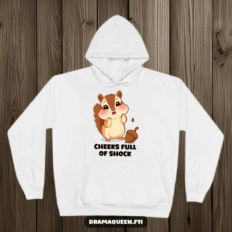 Funny chipmunk hoodie with puffed cheeks, looking shocked at a falling acorn. Comfortable and humorous, great for gifting.