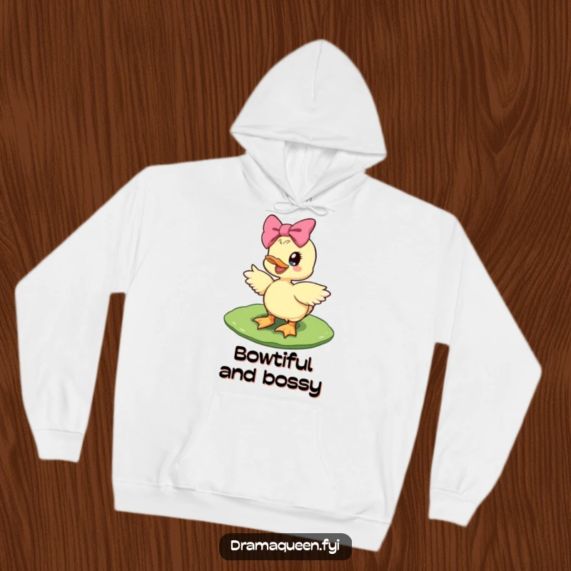 Funny diva duckling hoodie showing a delighted duckling with a giant bow striking a diva pose on a lily pad, soft and stylish.