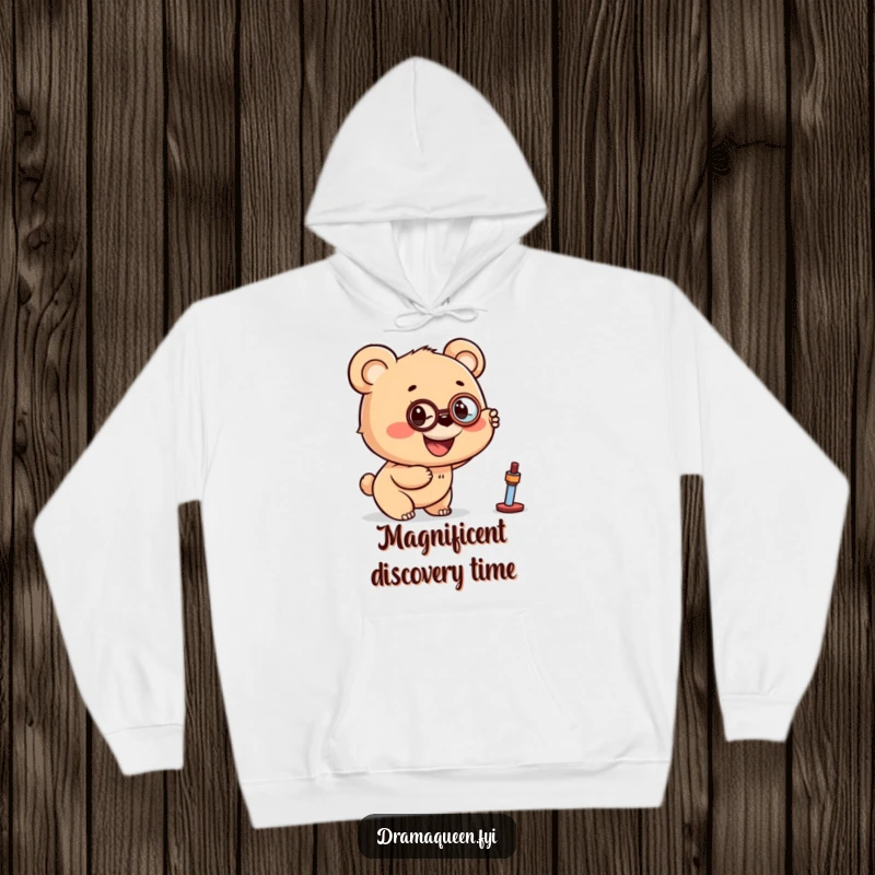 Funny hoodie featuring a bear cub with a monocle pointing excitedly at a distant object, offering cozy exploration.