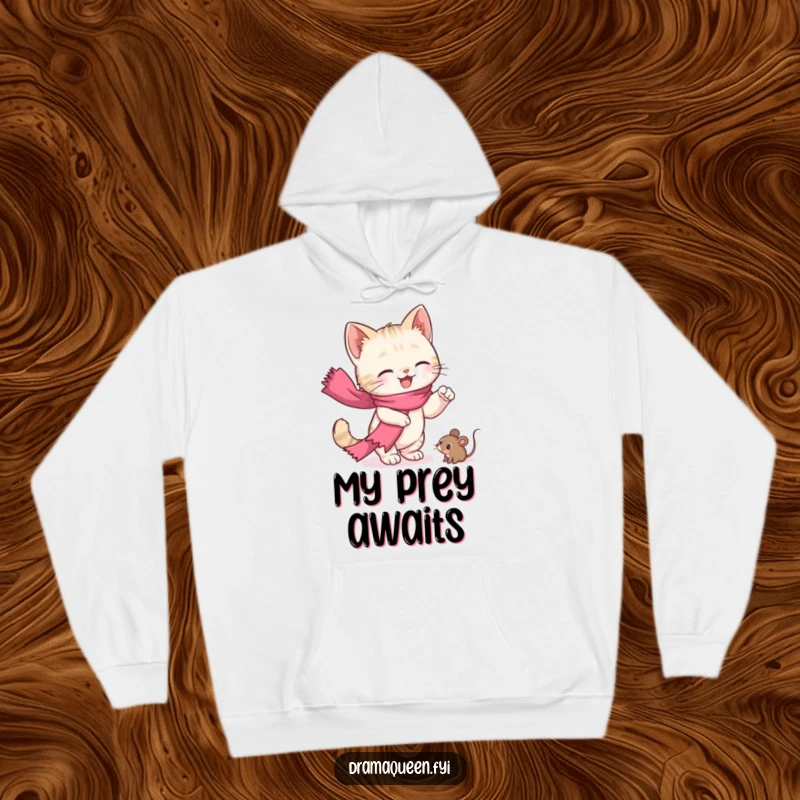 Funny kitten hoodie featuring a cute cat with a pink scarf in a dramatic pose, reaching for a toy mouse, very cozy.