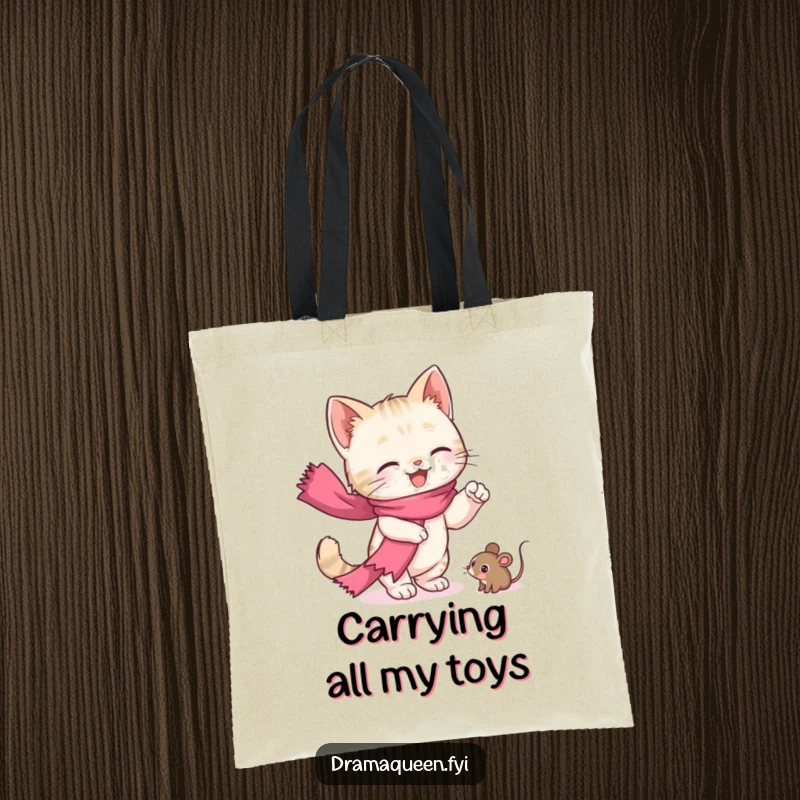 Funny kitten tote bag showing a cute cat with a pink scarf, dramatically reaching for a toy mouse, great for shopping.